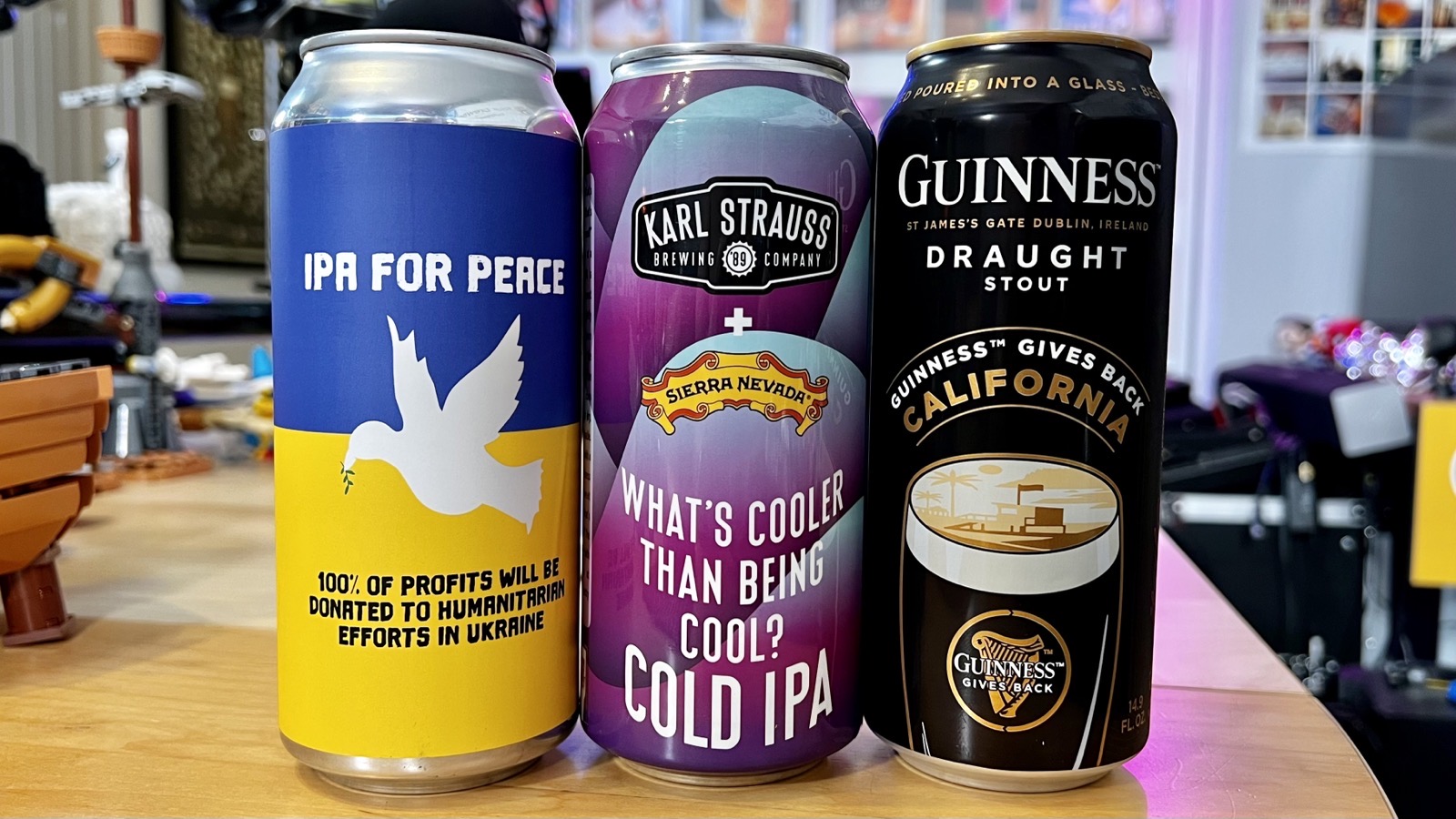 Pictured: Three cans of John's beers on the table in the four brewers studio.